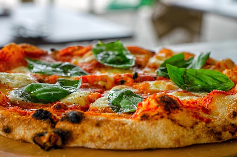 Four cheese artisan punch pizza with mozzarella and gorgonzola