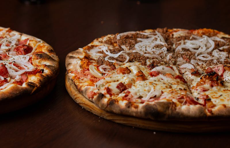 BBQ chicken punch pizza with smoky sauce and red onion